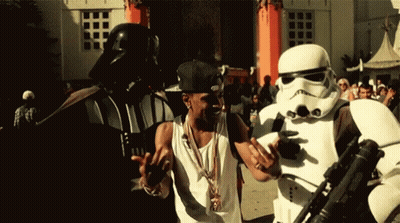 Stormtrooper Man Next To Darth Vader Costume GIF