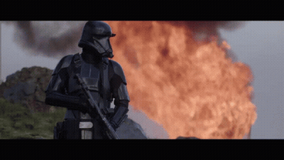 Stormtrooper Standing In Front Of Fire GIF
