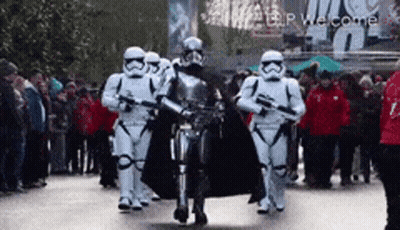 Stormtroopers Marching Down Street in Front of Crowd