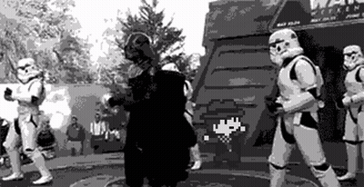 Stormtroopers Standing Around Man in Black and White Photo