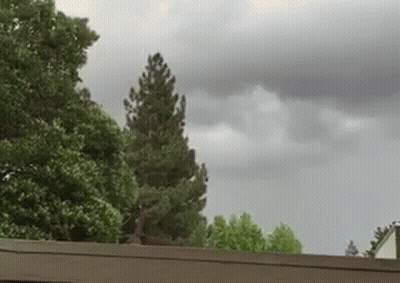 Stormy Sky With Trees And House GIF
