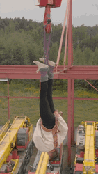 Straight Jacket Hanging Upside Down GIF