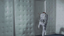 Straight Jacket Trying To Escape The Room GIF