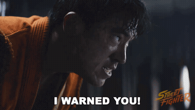 Street Fighter Poster Man In Orange Shirt Saying I Warned You GIF