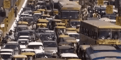 Street With Cars Buses And Ambulance Sign GIF