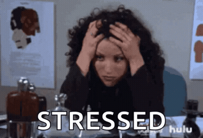 Stressed Woman At Desk With Hands On Head GIF