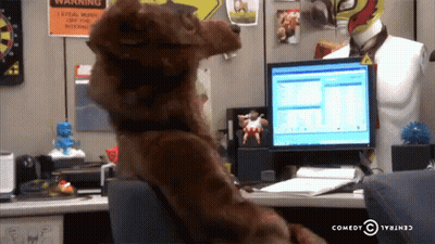 Stuffed Animal At Desk With Computer And Warning Sign GIF