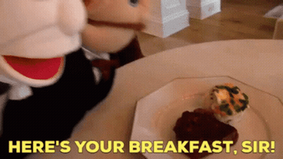 Stuffed Animal At Table With Breakfast Saying Here's Your Breakfast Sir GIF