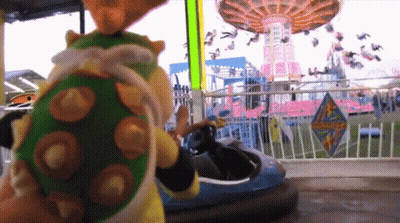 Stuffed Animal By Bumper Car At Amusement Park GIF