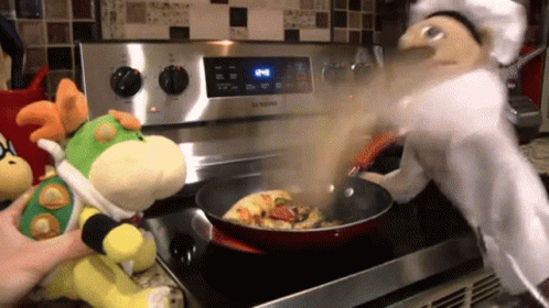 Stuffed Animal Cooked In Frying Pan By Puppet Chef GIF