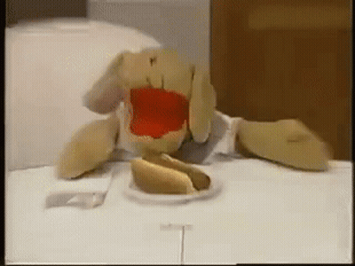 Stuffed Animal Eating Hot Dog With Ketchup GIF