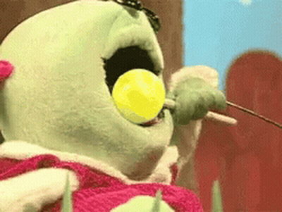 Stuffed Animal Eating Yellow Lollipop GIF