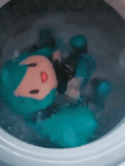 Stuffed Animal Floating In Washing Machine GIF