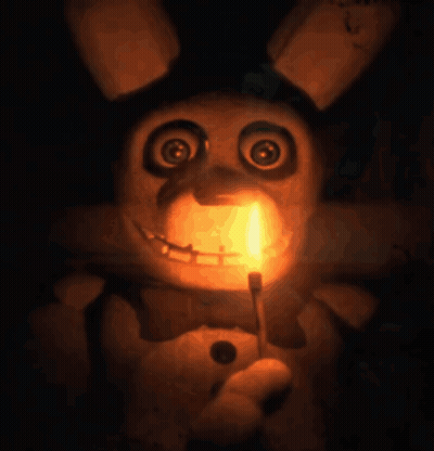 Stuffed Animal Holding Candle In Mouth GIF