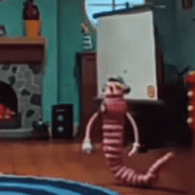 Stuffed Animal In Living Room With Fireplace GIF