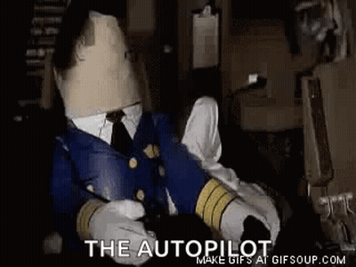 Stuffed Animal In Pilot Uniform Sitting In Dark Room With Cardboard Head GIF