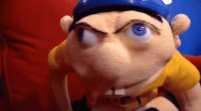 Stuffed Animal In Yellow Shirt And Blue Hat GIF