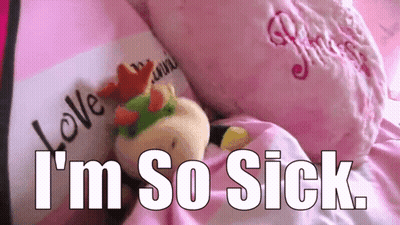 Stuffed Animal Laying On Bed Saying I'm So Sick GIF