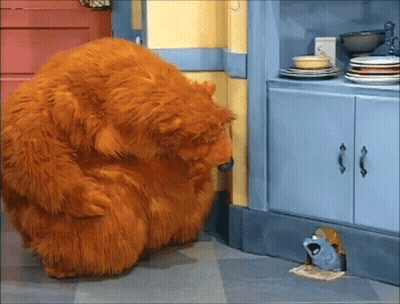 Stuffed Animal Looking Through Hole In Wall GIF