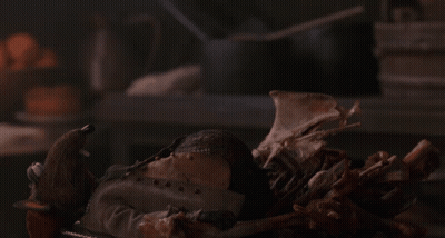 Stuffed Animal Lying On Bones GIF