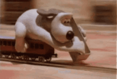 Stuffed Animal Riding On Back Of Train GIF