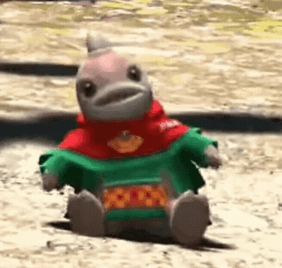 Stuffed Animal Sitting In Sweater GIF