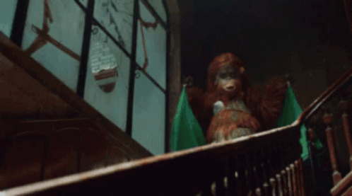 Stuffed Animal Sitting On Staircase GIF