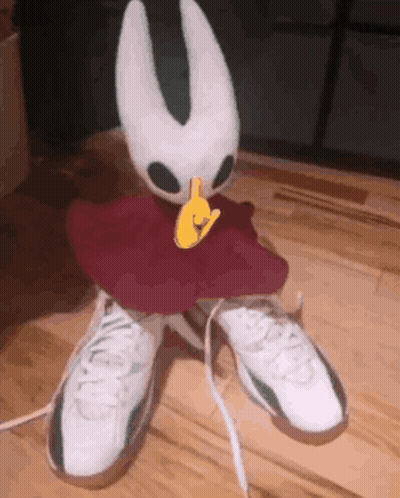 Stuffed Animal Sitting On White Sneakers GIF