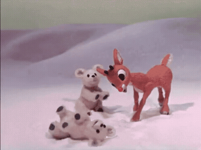 Stuffed Animal Standing Next To Stuffed Animal Laying In Snow GIF