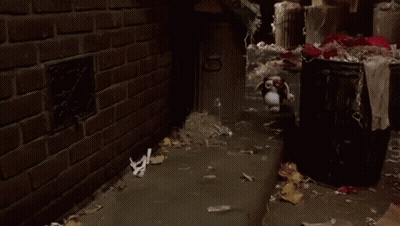 Stuffed Animal Standing On Sidewalk Next To Brick Wall Number 10 GIF