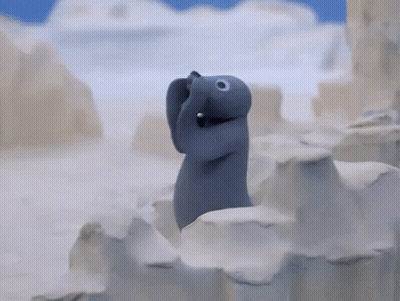 Stuffed Animal Standing On Snow Covered Iceberg GIF
