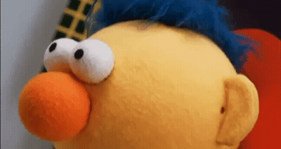 Stuffed Animal With Big Eyes And Blue Hair GIF