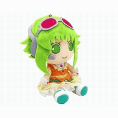 Stuffed Animal With Green Hair And Glasses Laying Upside Down GIF