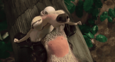 Stuffed Animal With Pink Belly Laying On Ground GIF