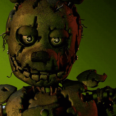 Stuffed Animal With Red Eye On Green Background GIF