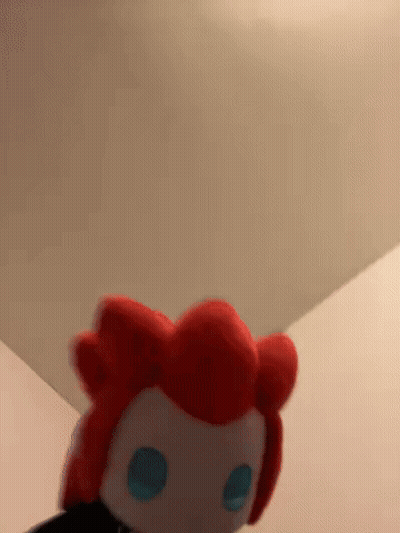 Stuffed Animal With Red Hair And Blue Eyes GIF