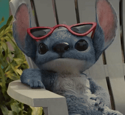 Stuffed Animal With Red Sunglasses On Chair GIF