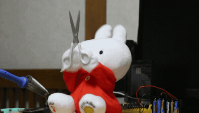 Stuffed Animal With Scissors In Mouth GIF
