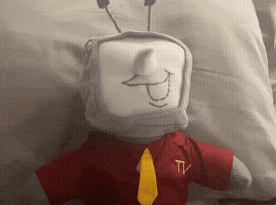 Stuffed Animal With TV Logo On Shirt And Tie GIF