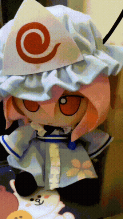 Stuffed Animal With White Hat And Red Swirl GIF