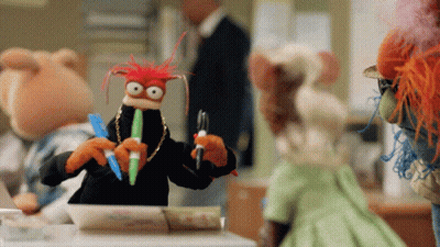 Stuffed Animals Around Table With Pen In Mouth GIF