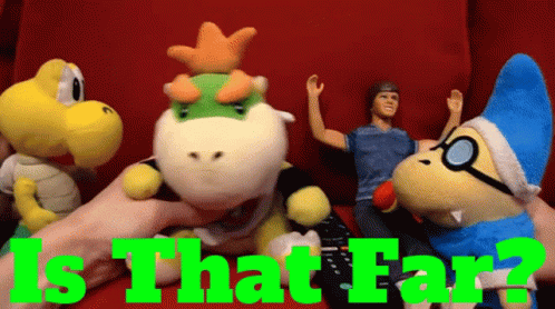 Stuffed Animals Held By Person With Is That Far Text GIF