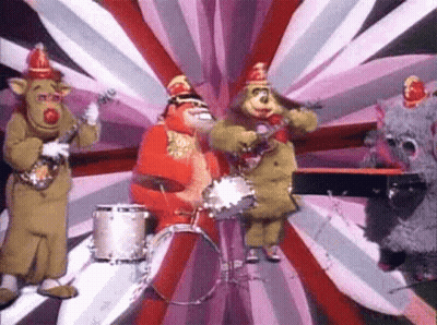 Stuffed Animals Playing Instruments On Stage GIF