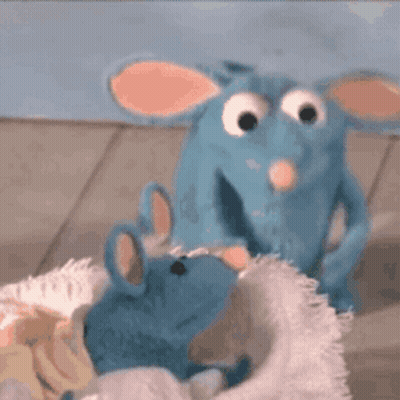 Stuffed Animals Sitting On Bed GIF