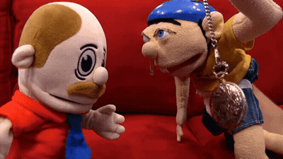 Stuffed Animals Sitting On Red Couch GIF