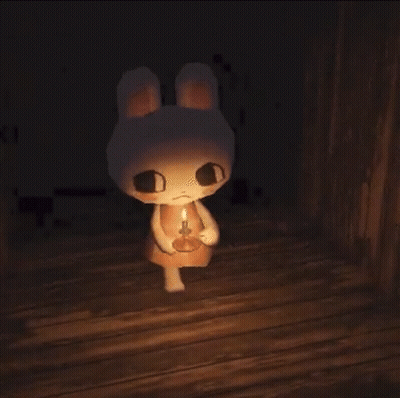 Stuffed Bunny Rabbit Holding Candle In Dark Room GIF