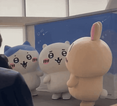 Stuffed Cat And Bunny Standing Together GIF