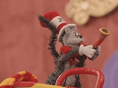 Stuffed Cat In Hat Blowing Horn GIF