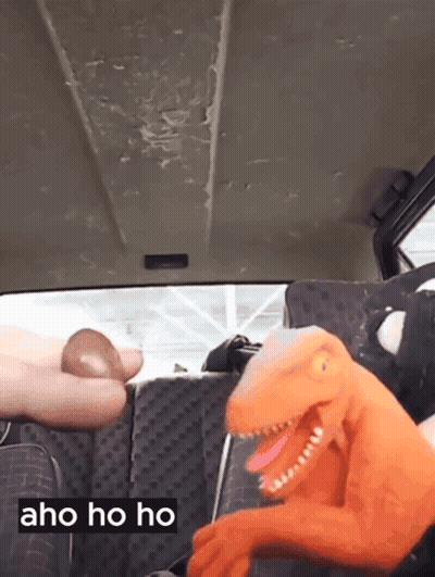Stuffed Dinosaur In Back Seat Saying Aho Ho Ho GIF