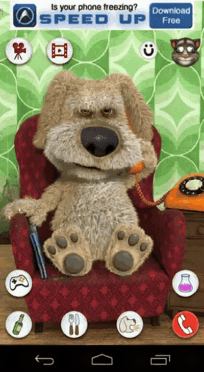 Stuffed Dog Sitting In Chair With Phone In Mouth GIF